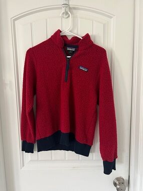 Patagonia women’s cropped Red Sherpa Half-Zip Jacket with Navy Trim